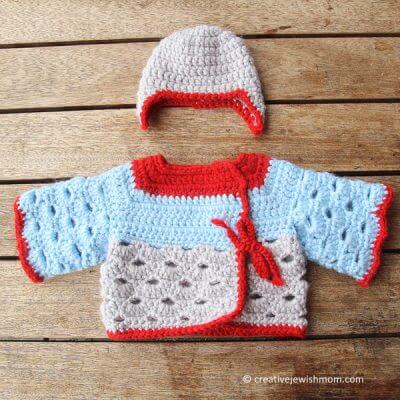 Crocheted Baby Sweater With Scallop Stitch